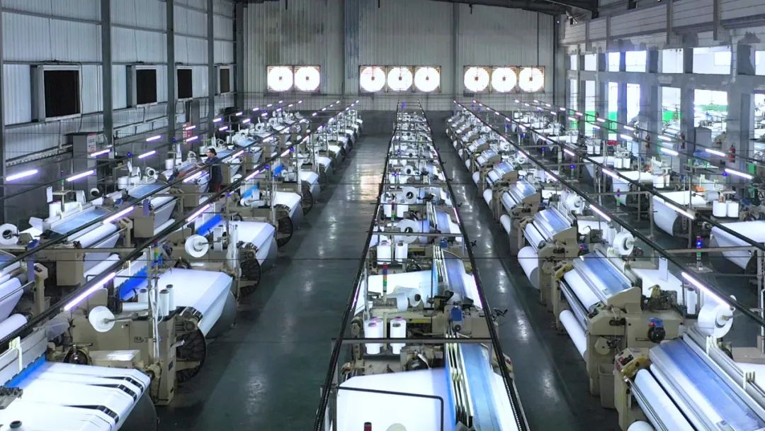 萬興?。合蛐绿豳|，打造首選梭織面料合作伙伴